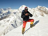 
Climbing Sherpa Lal Singh Tamang Taking Pictures Of Me On The Chulu Far East Summit At 6056m At 9am With Annapurna I, Chulu East and Central Behind
